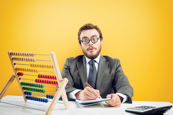 Accountant counting on an abacus